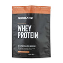 Nduranz Whey Protein – 820 g, Milchschokoladengeschmack, wiederverschließbare schwarz-braune Verpackung mit Verzehrhinweisen auf weißem Hintergrund.